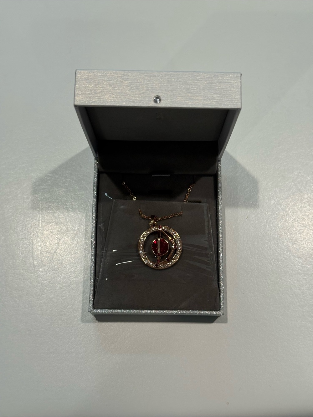 Gold-Tone Necklace with Red Gemstone Pendant
